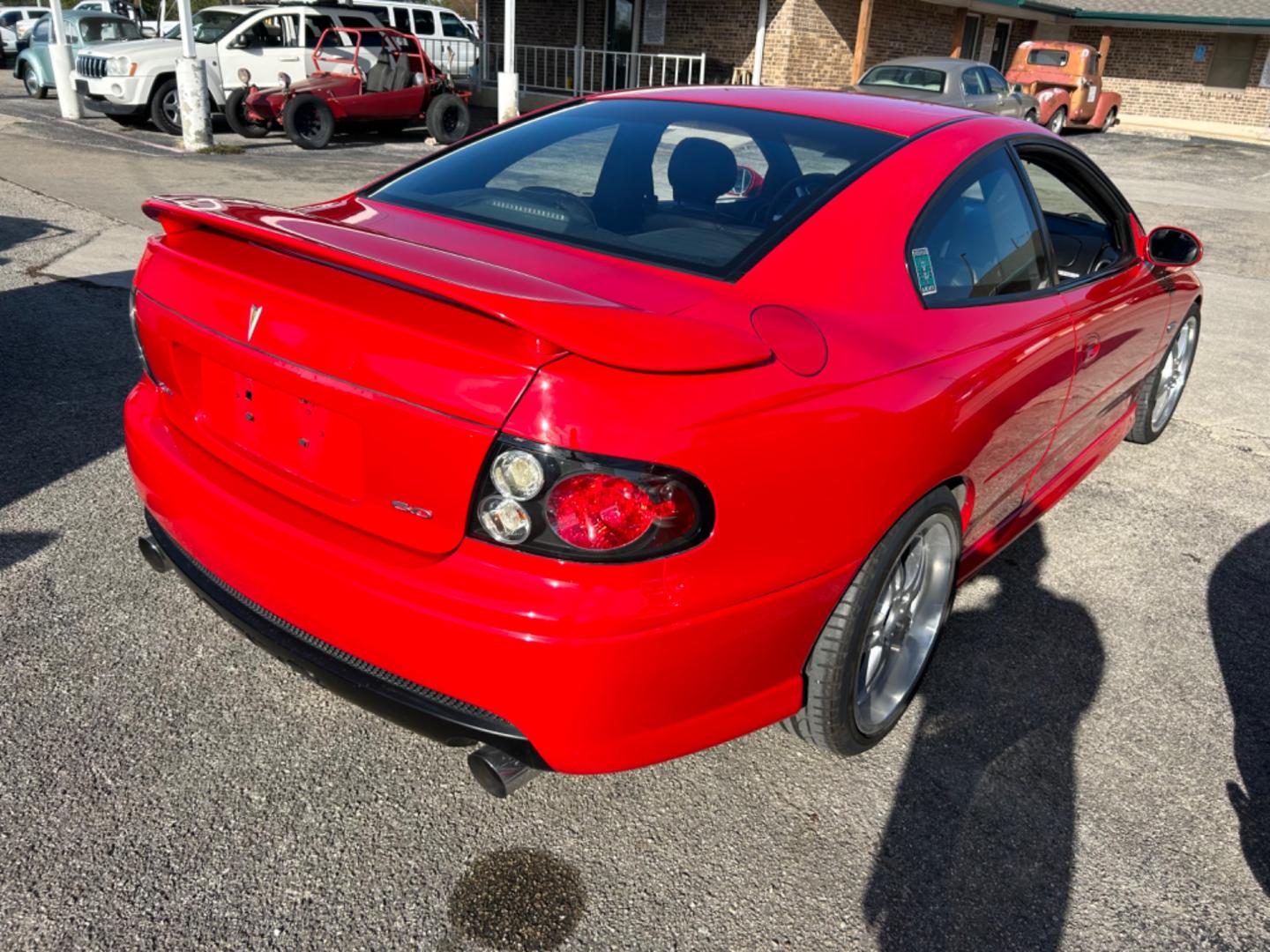 2006 Red Pontiac GTO Coupe (6G2VX12U96L) with an 6.0L V8 OHV 16V engine, located at 1687 Business 35 S, New Braunfels, TX, 78130, (830) 625-7159, 29.655487, -98.051491 - Photo#2